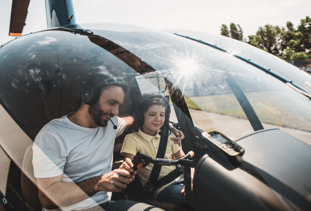 The girl is being taught how to fly an airplane, learning how the plane takes off