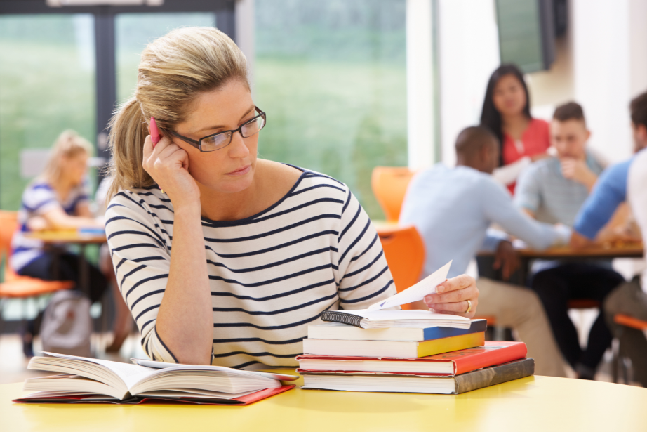 The girl is studying in a homeschool classroom.
